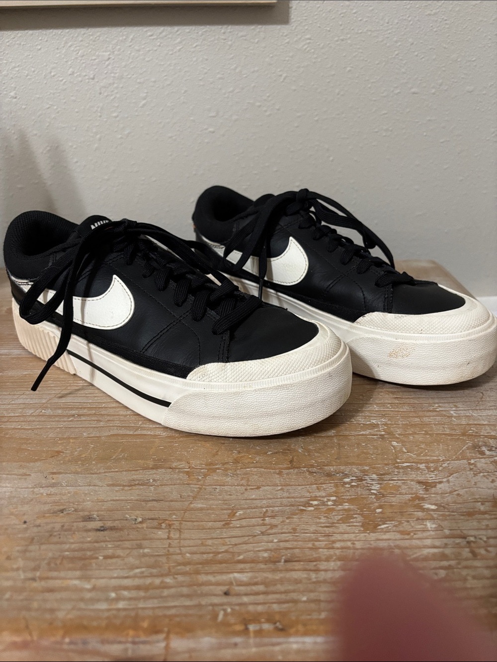 Nike Women’s Black and White Leather Lace-Up Sneakers